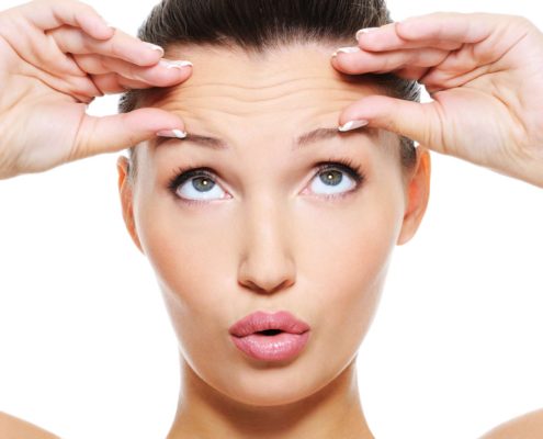 female face with wrinkles on her forehead female face with wrinkles on her forehead